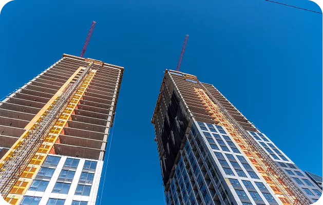 High-rise buildings under construction in Chicago, showcasing KWPMC Midwest pre-construction property management and development consulting services.