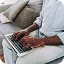 Resident using the KWPMC Midwest online portal to manage payments and association requests conveniently from home in Chicago.